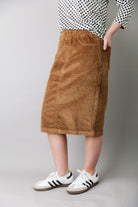 Model wearing Nuggles® 25-inch corduroy skirt