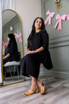 Model wearing Nuggles® Eleanor Top in Black