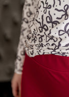 Model wearing Nuggles® 27" Relaxed Skirt in Brick Red