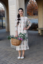 Model wearing Nuggles®  original midi layering dress in print