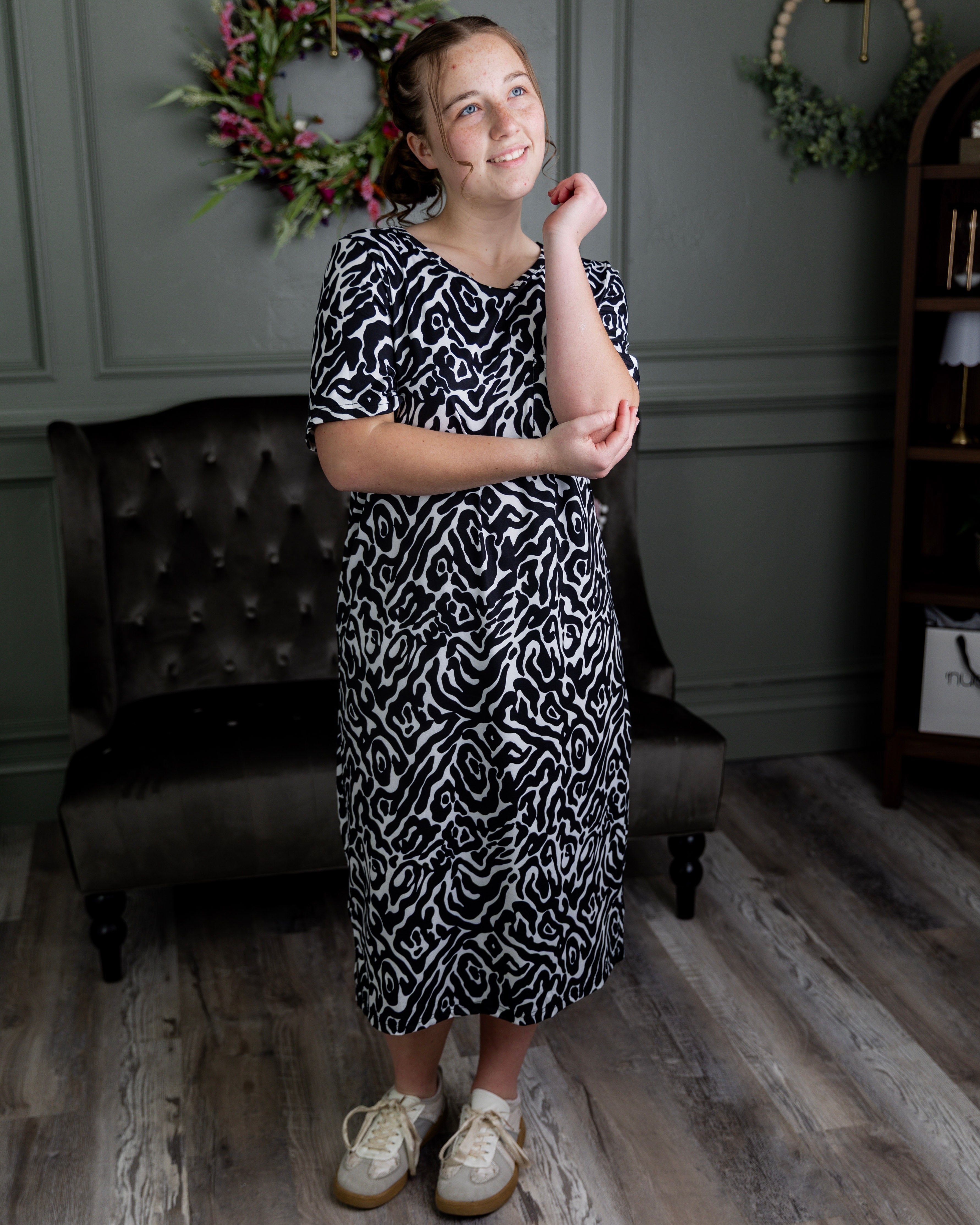 Model wearing Nuggles® Aviva Dress in Black Ink Bloom