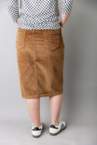 Model wearing Nuggles® 25-inch corduroy skirt