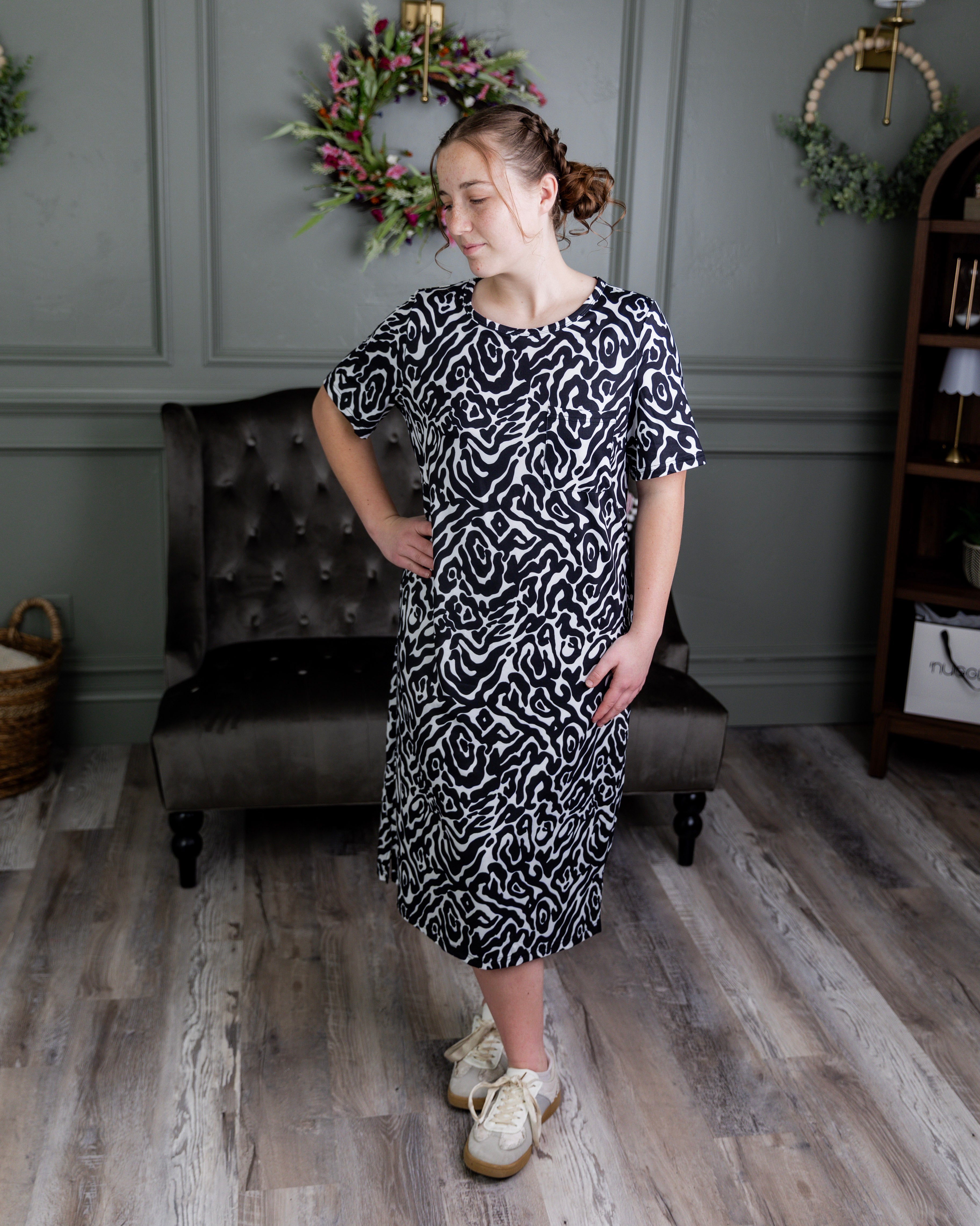 Model wearing Nuggles® Aviva Dress in Black Ink Bloom