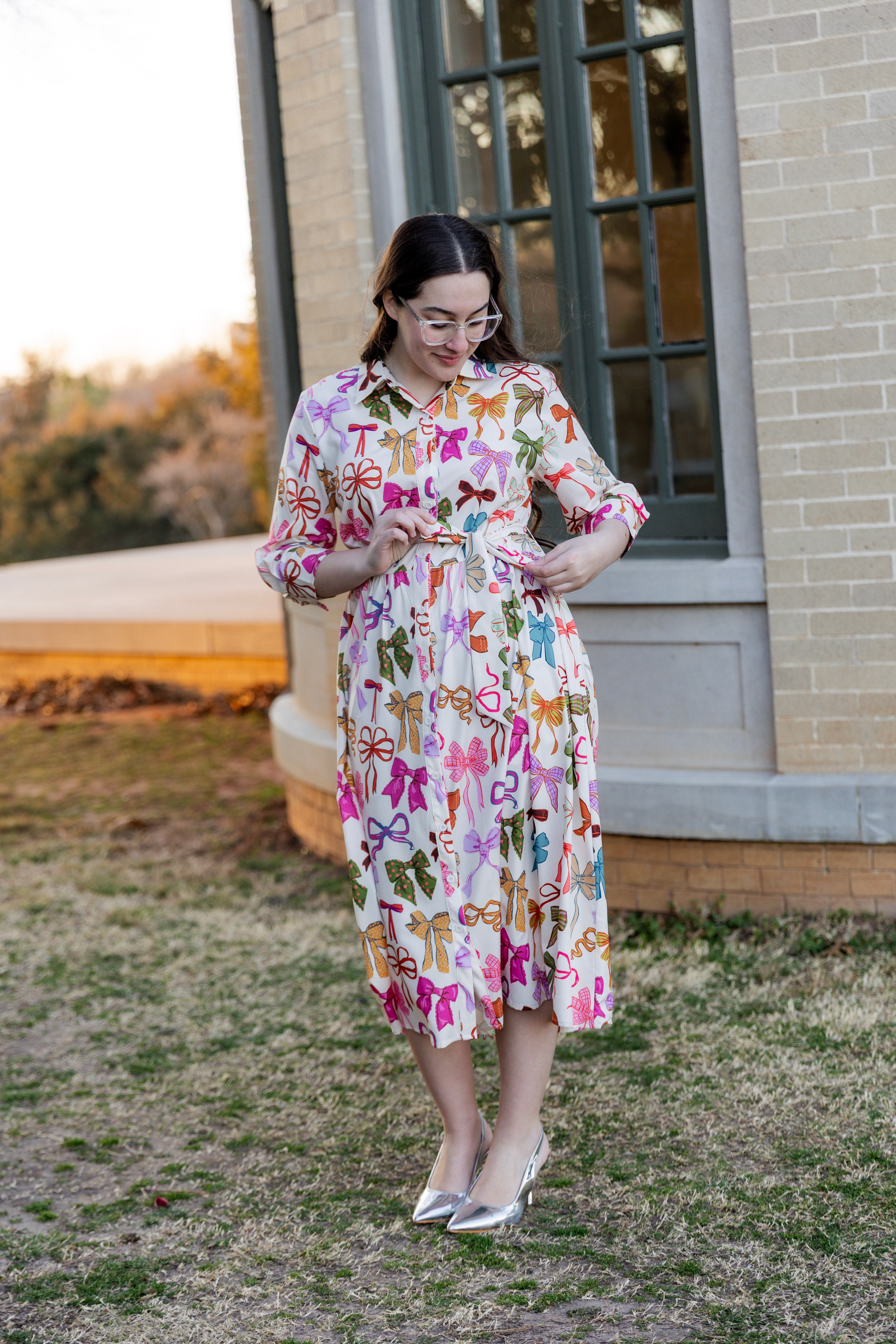 Model wearing the Nuggles® Rachel Dress in Bow Garden