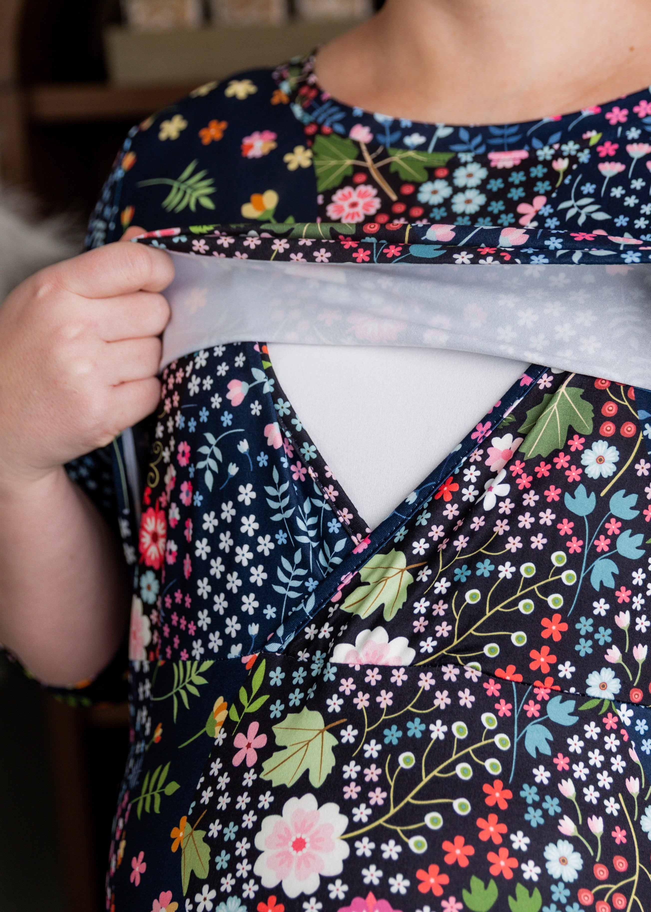 Model wearing Nuggles® Nalani Nursing Dress in Star Garden