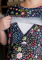 Model wearing Nuggles® Nalani Nursing Dress in Star Garden