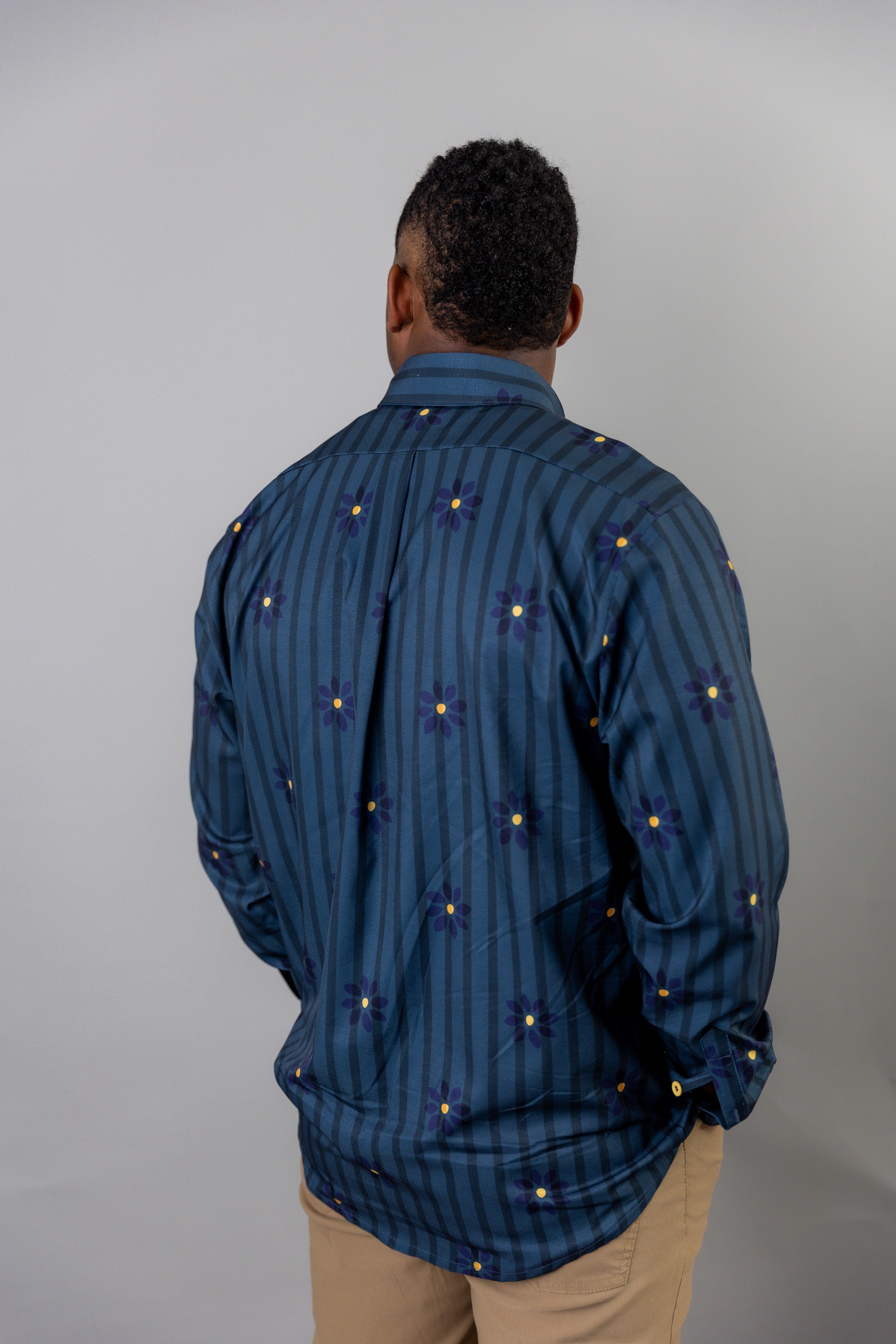 Model wearing Nuggles® Men's Button Down Shirt in Pinstripe Ditsy