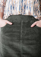 Model wearing Nuggles® 27-inch corduroy skirt