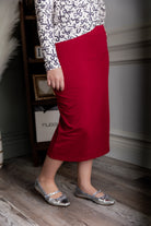 Model wearing Nuggles® 27" Relaxed Skirt in Brick Red