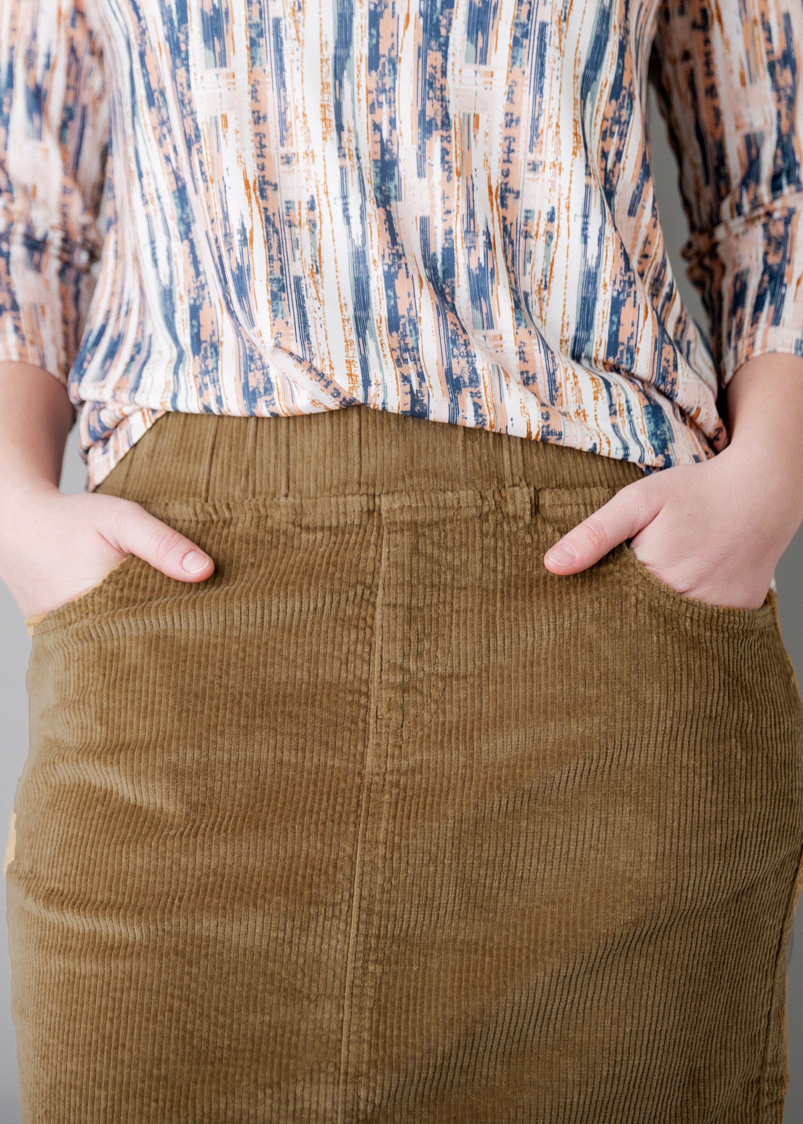 Model wearing Nuggles® 27-inch corduroy skirt