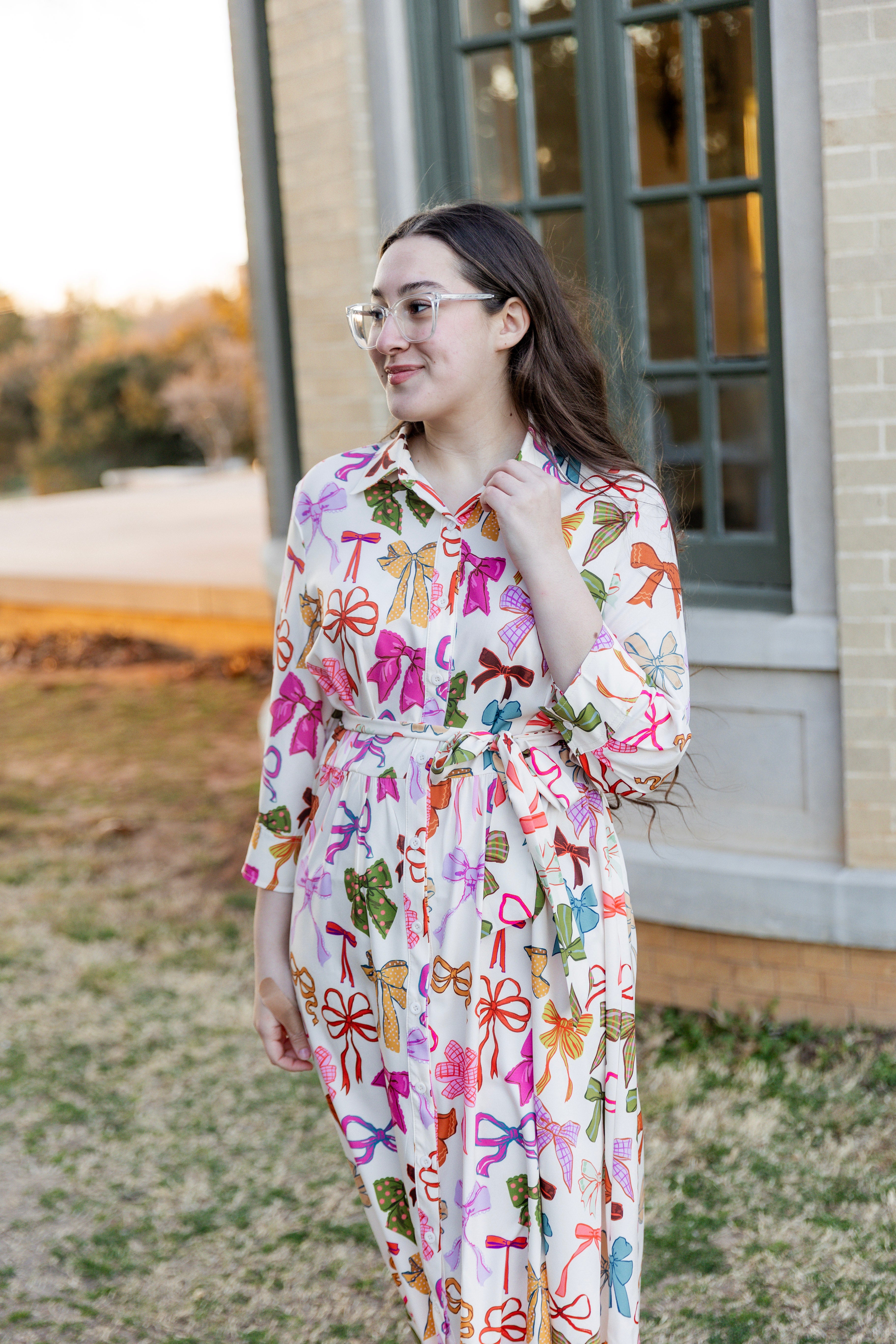 Model wearing the Nuggles® Rachel Dress in Bow Garden