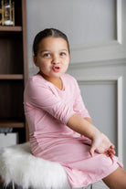 Model wearing our Nuggles® girls midi layering dress