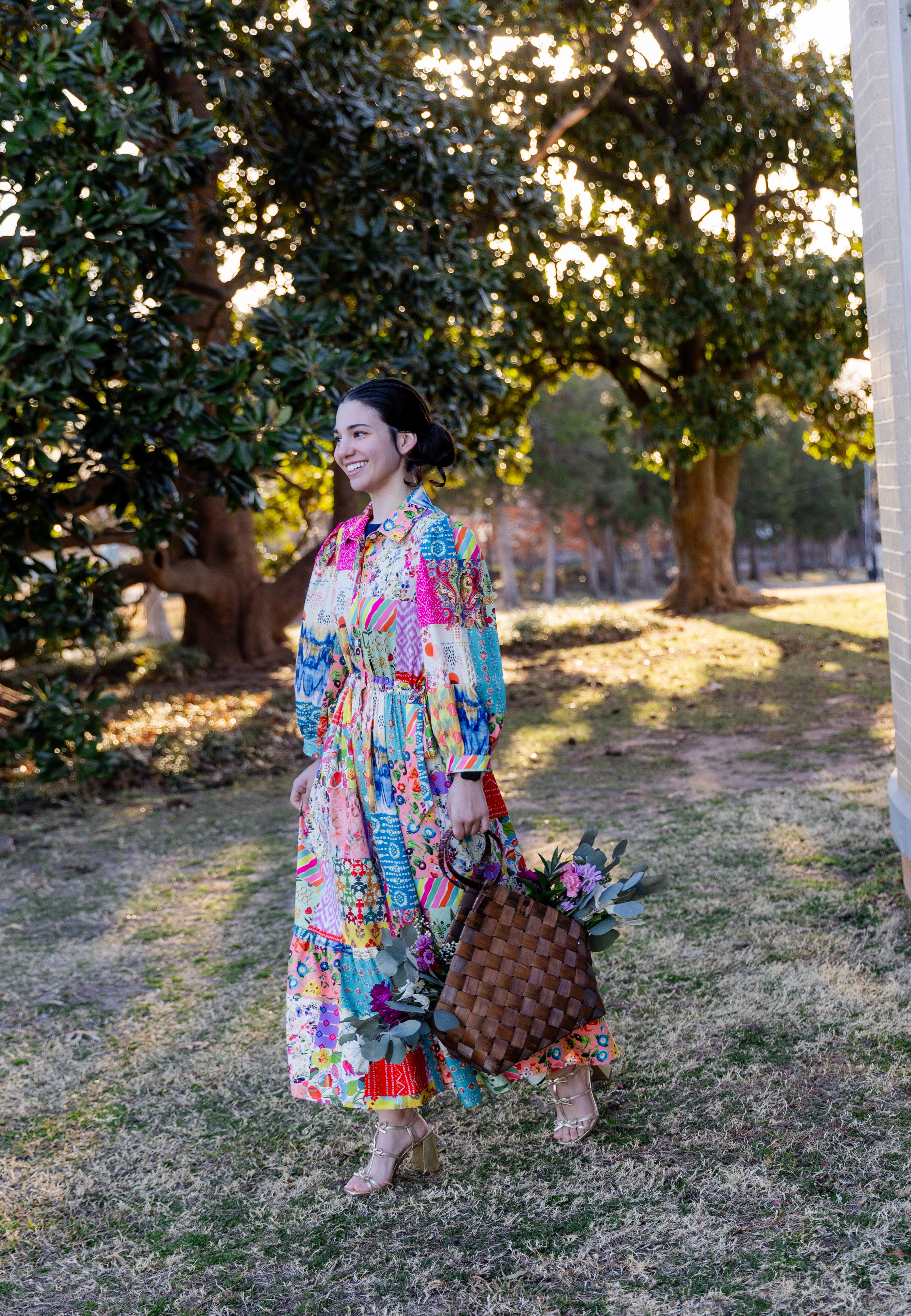 Model wearing the Nuggles® Leila Dress in Keepsake Quilt