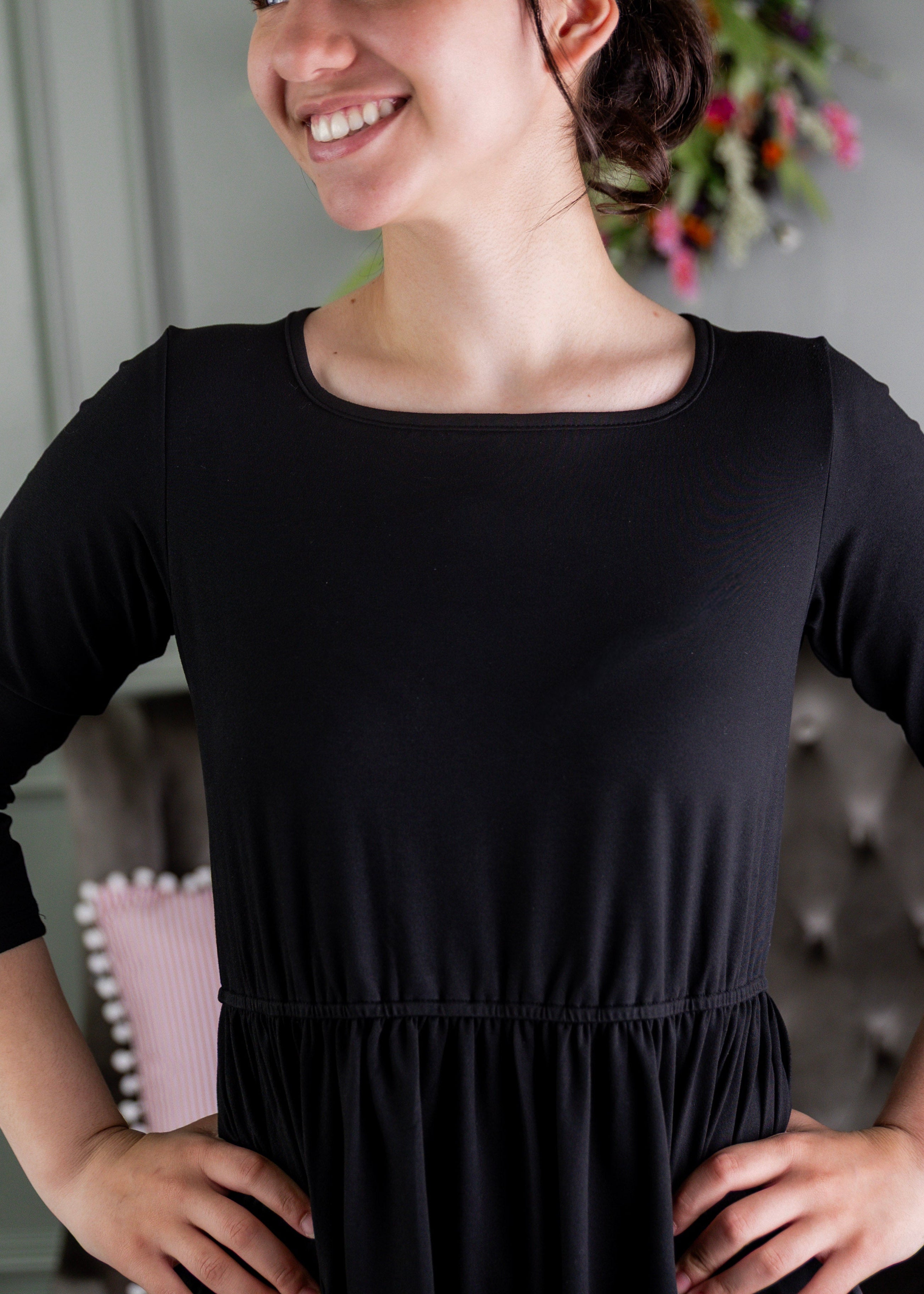 Model wearing Modest Nuggles® Nova Dress in Black