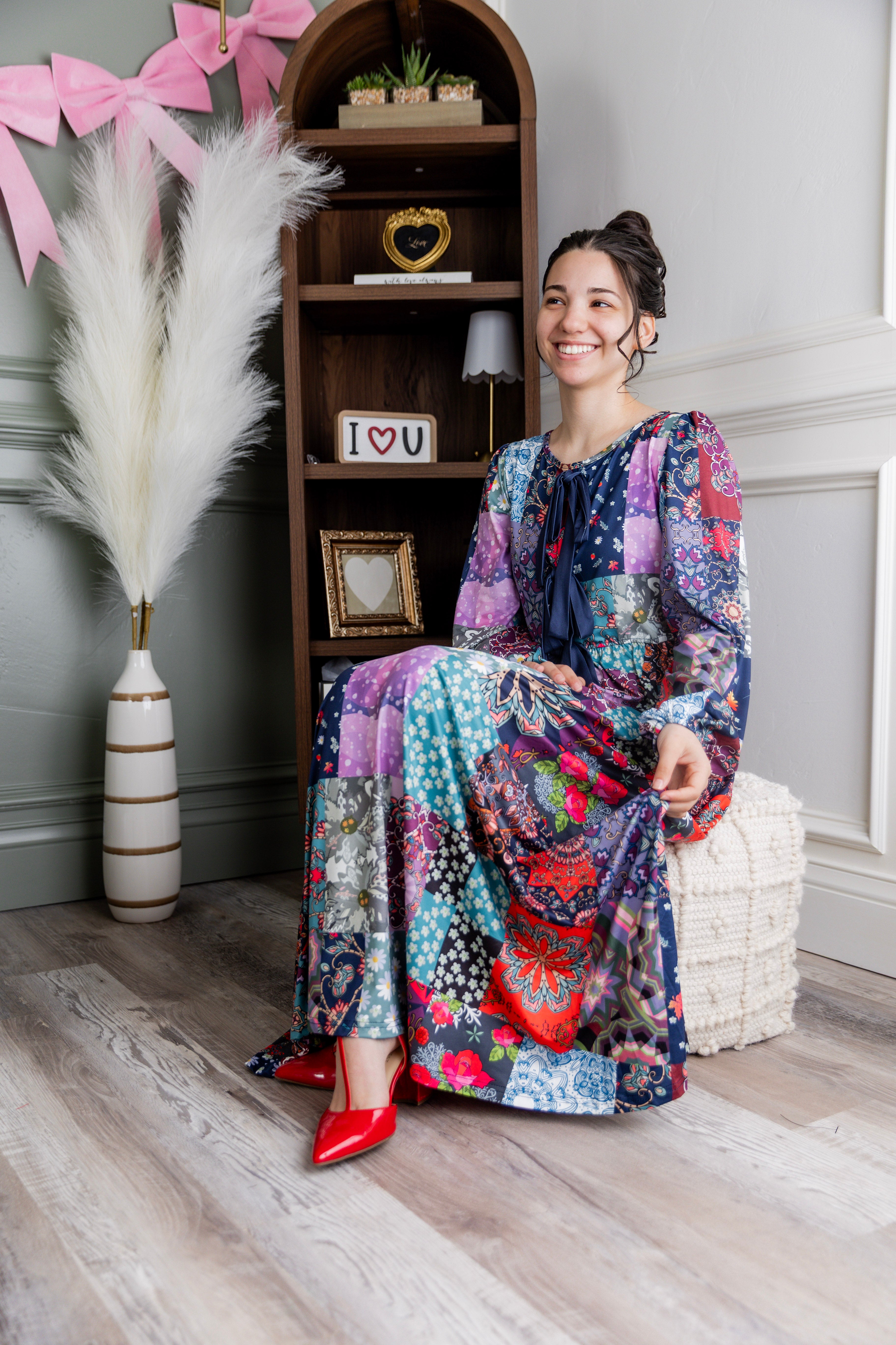 Model wearing the Nuggles® Addison Dress in Stitch & Sparkle