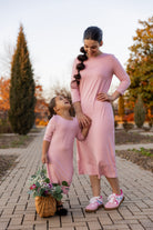 Models wearing Nuggles®  original midi layering dress in Baby Pink