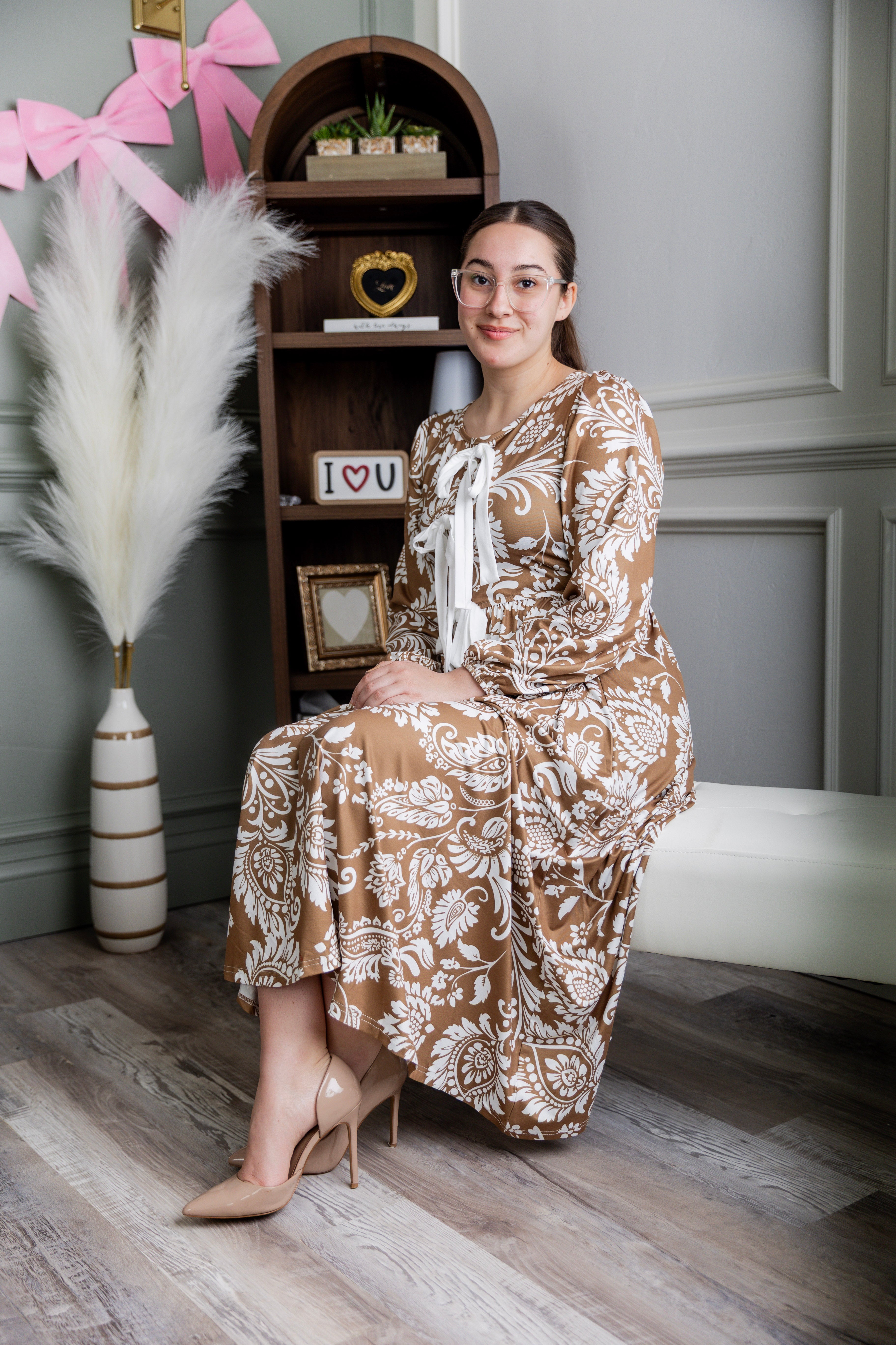 Model wearing the Nuggles® Addison Dress in Cinnamon Swirl Paisley