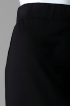 Model wearing Nuggles® Relaxed Midi Skirt in Black