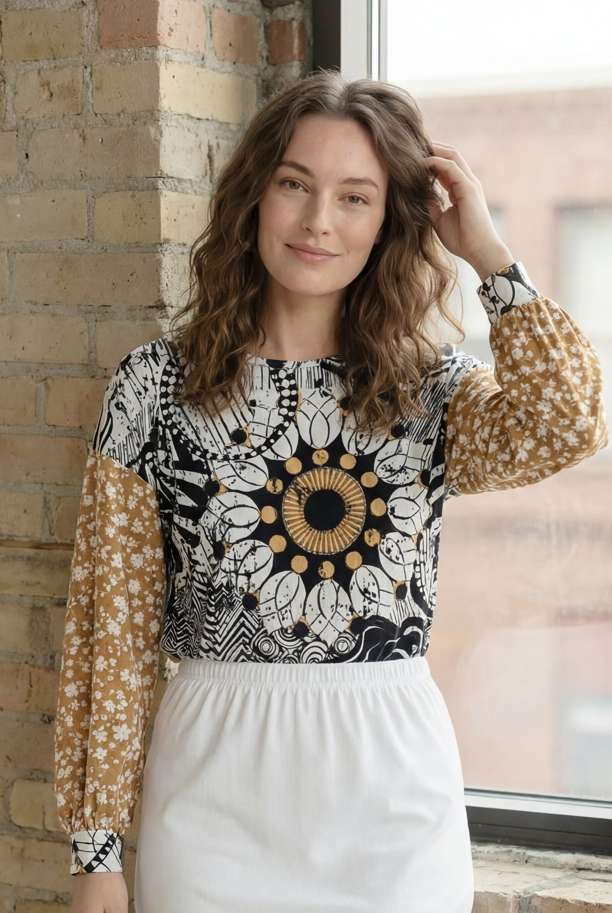 Model wearing the Nuggles® Bryauna Top in Sunlit Collage
