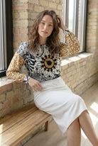 Model wearing the Nuggles® Bryauna Top in Sunlit Collage