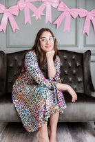 Model wearing Nuggles® Hazel Dress in Cotton Candy Cheetah print modest boutique style.