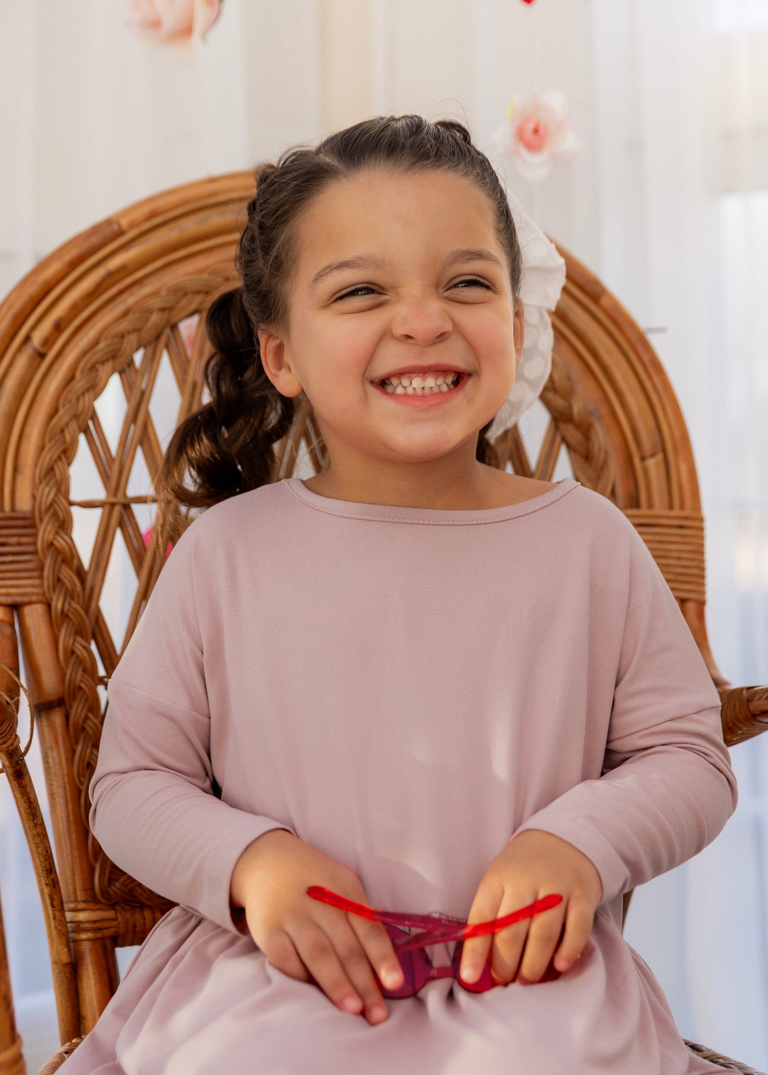 Model wearing the Nuggles® Girls' Farah Dress in Baby Pink