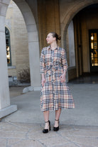 Model wearing the Nuggles® Rachel Dress in Sand Plaid