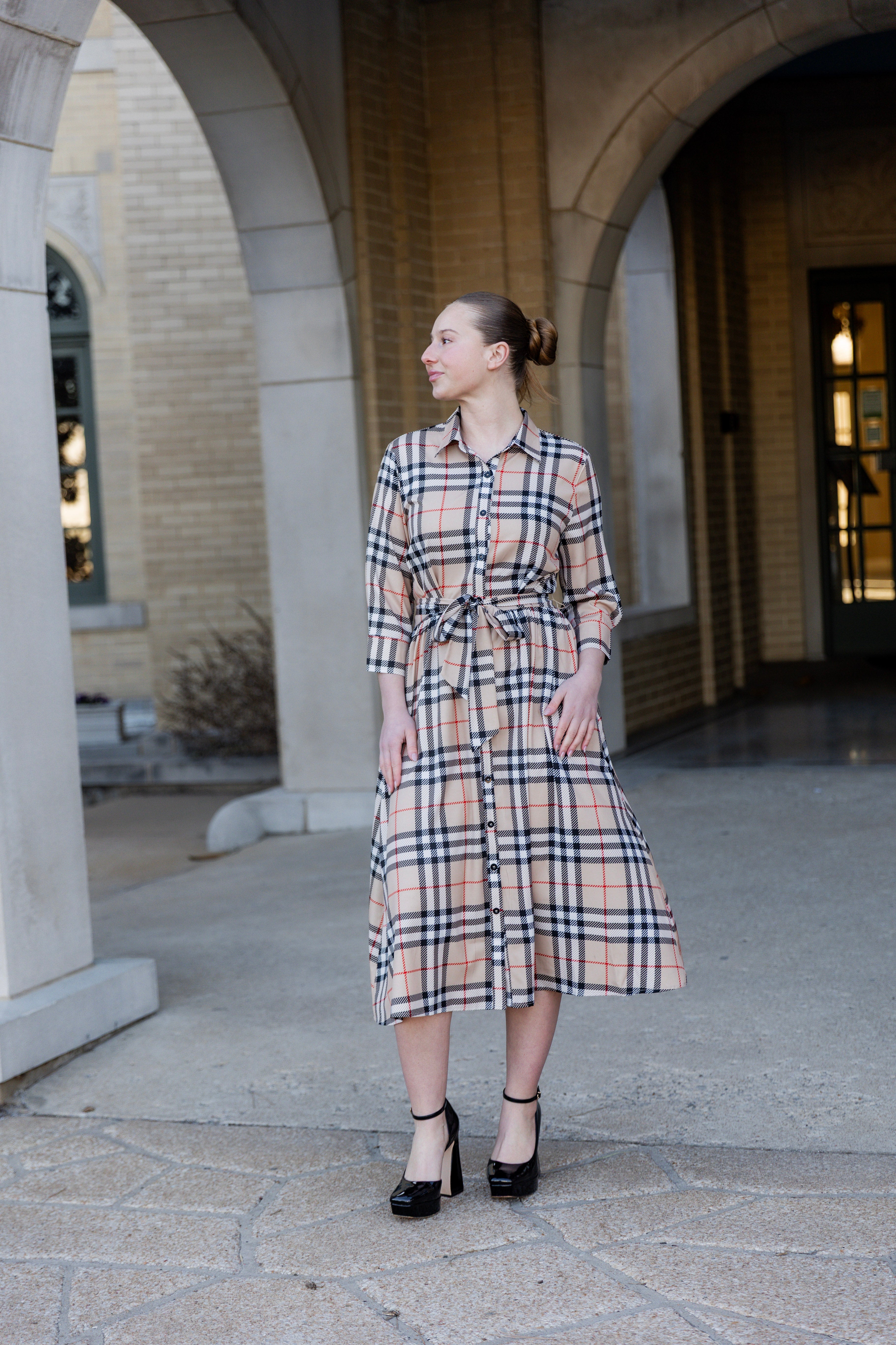 Model wearing the Nuggles® Rachel Dress in Sand Plaid