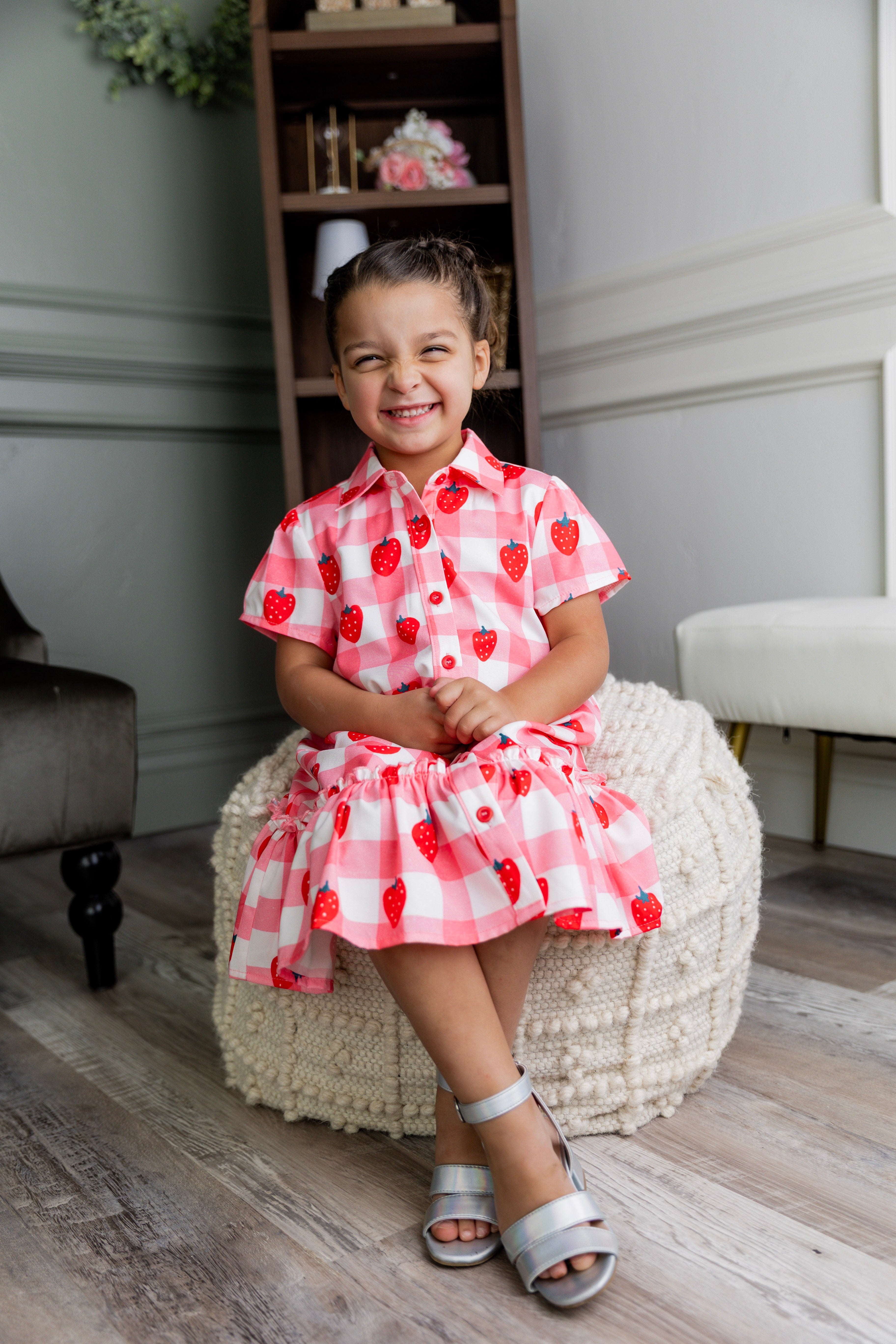 Model wearing Nuggles® Girls' Ellie Dress Dress in Strawberry Sweetheart