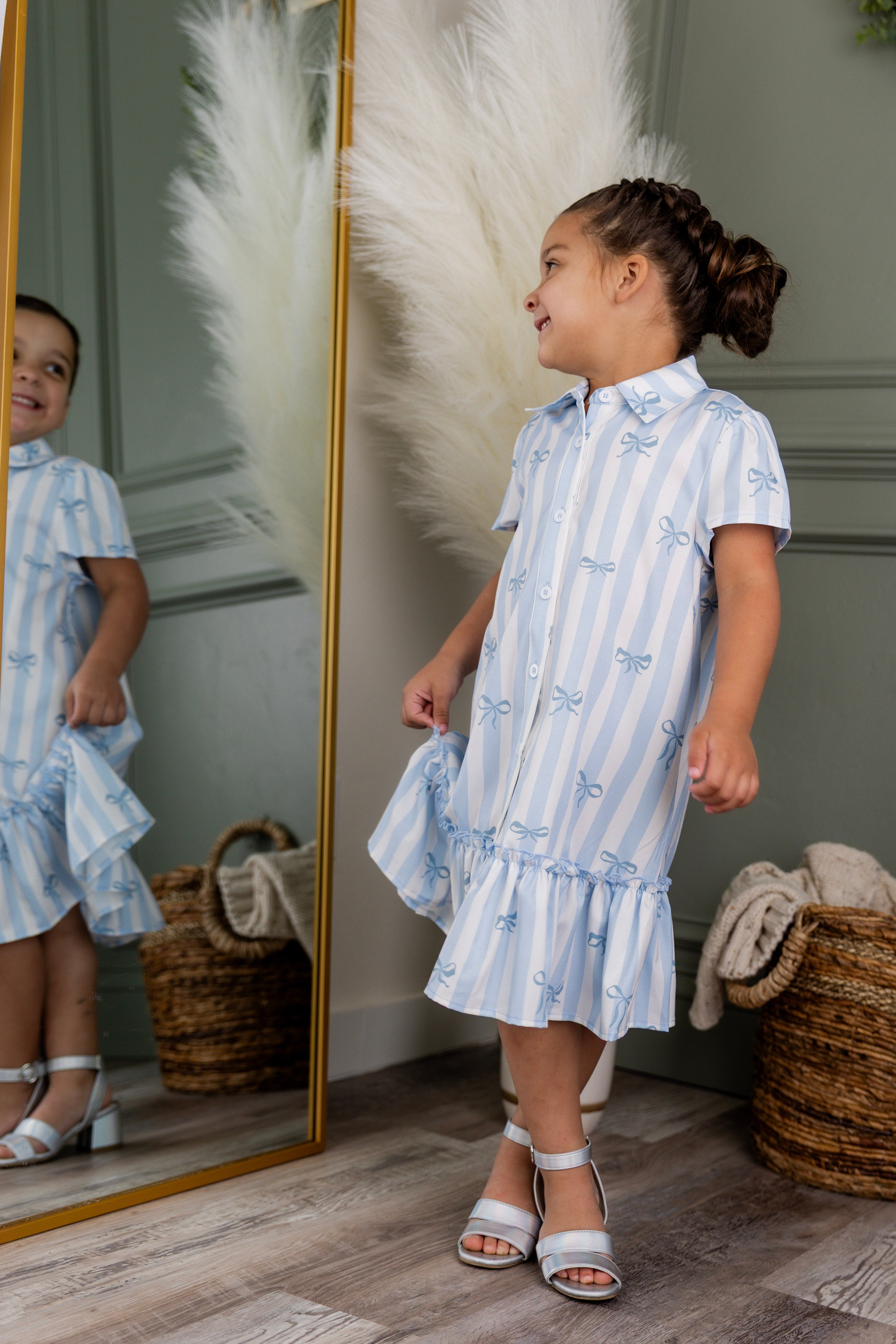 Model wearing Nuggles® Girls' Ellie Dress Dress in Sweet Ribbon Stripe