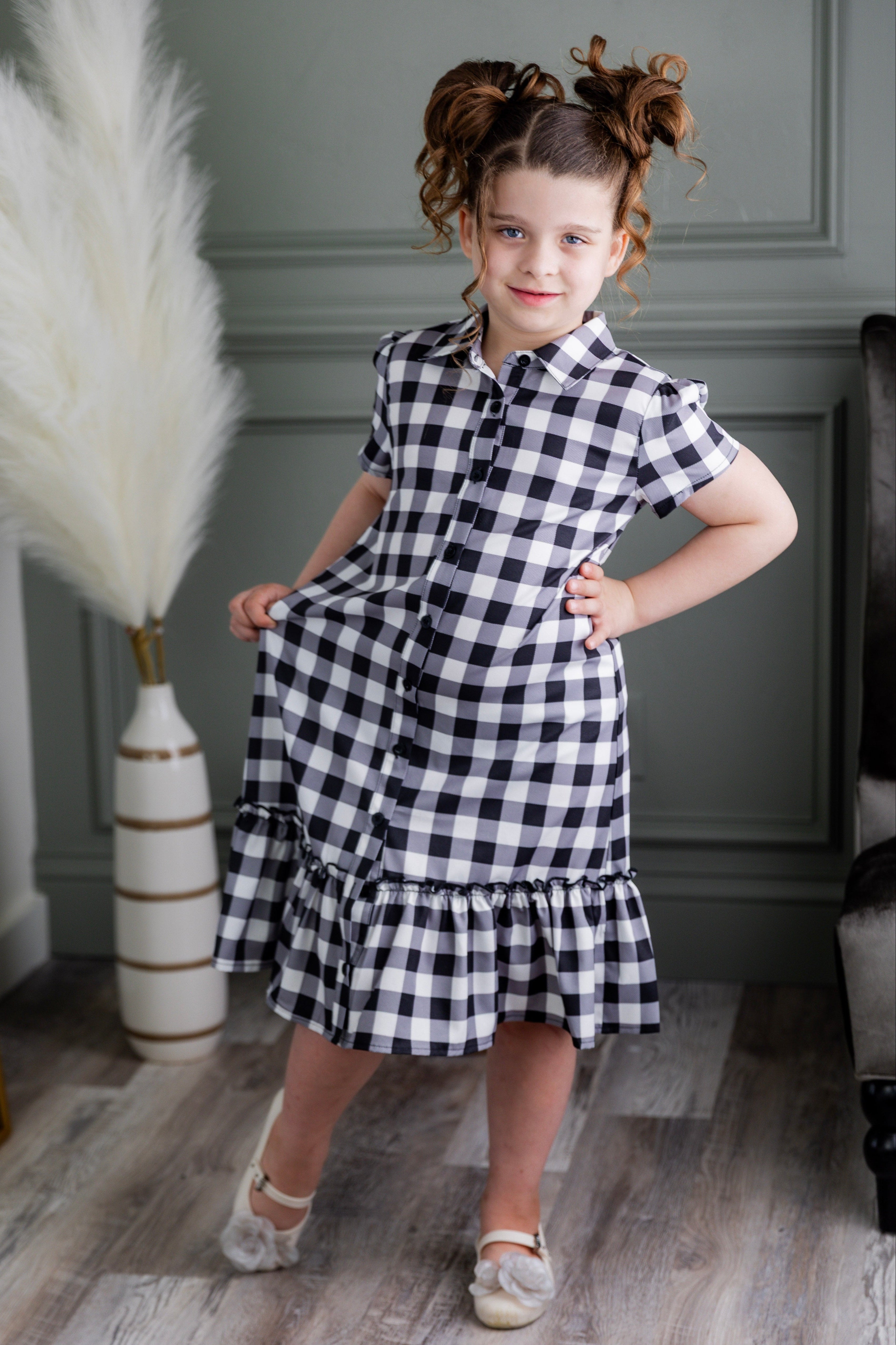 Model wearing Nuggles® Girls' Ellie Dress Dress in Storybook Check