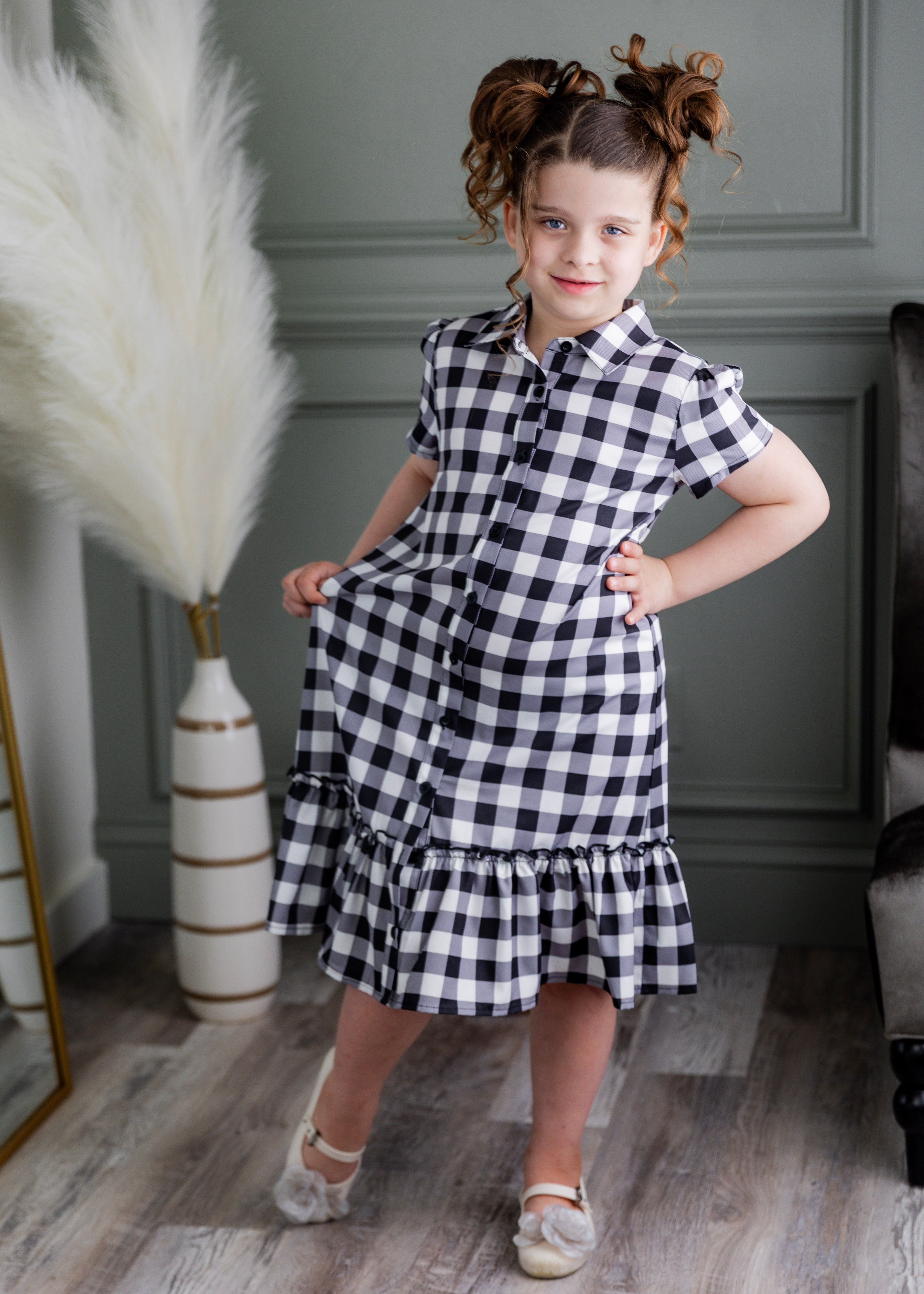 Model wearing Nuggles® Girls' Ellie Dress Dress in Storybook Check