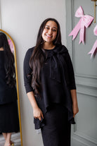 Model wearing Nuggles® Eleanor Top in Black