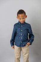 Model wearing Nuggles® Boy's Button Down Shirt in Pinstripe Ditsy