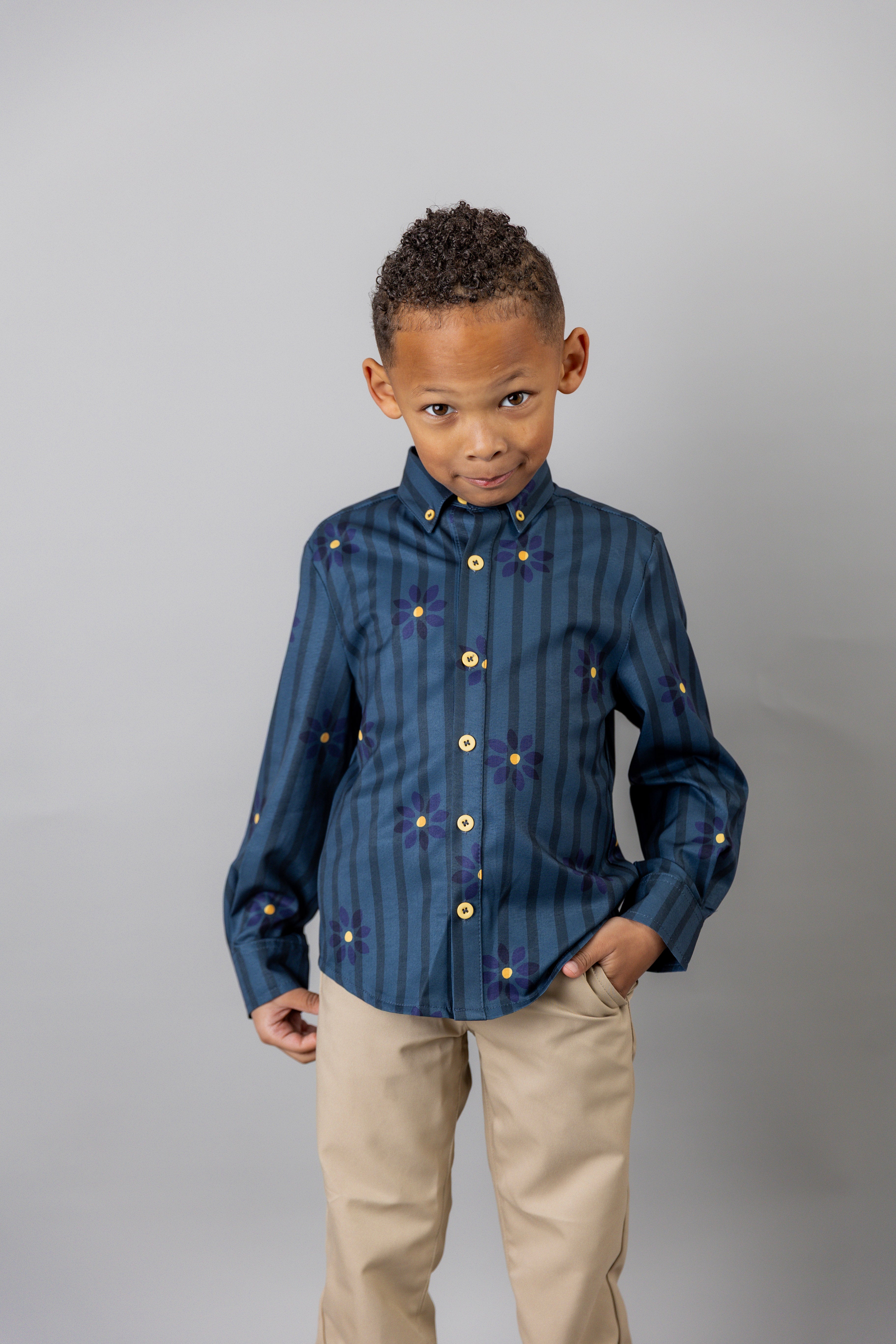 Model wearing Nuggles® Boy's Button Down Shirt in Pinstripe Ditsy