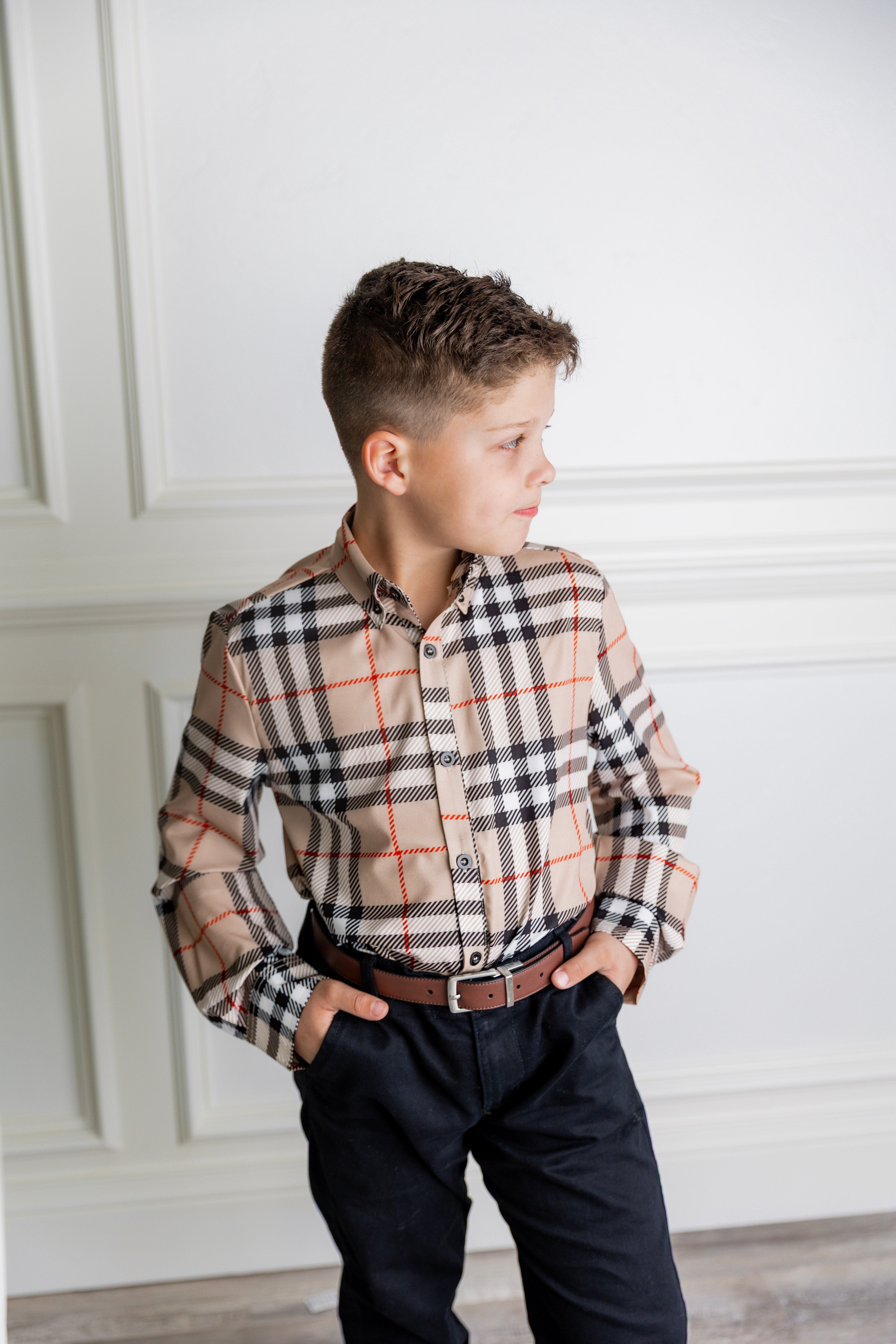 Model wearing Nuggles® Boys' Button Down Shirt Sand Plaid