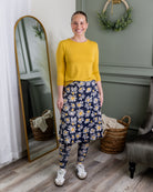 Model wearing Nuggles® Tilly Sport Skirt in Daisy After Dark