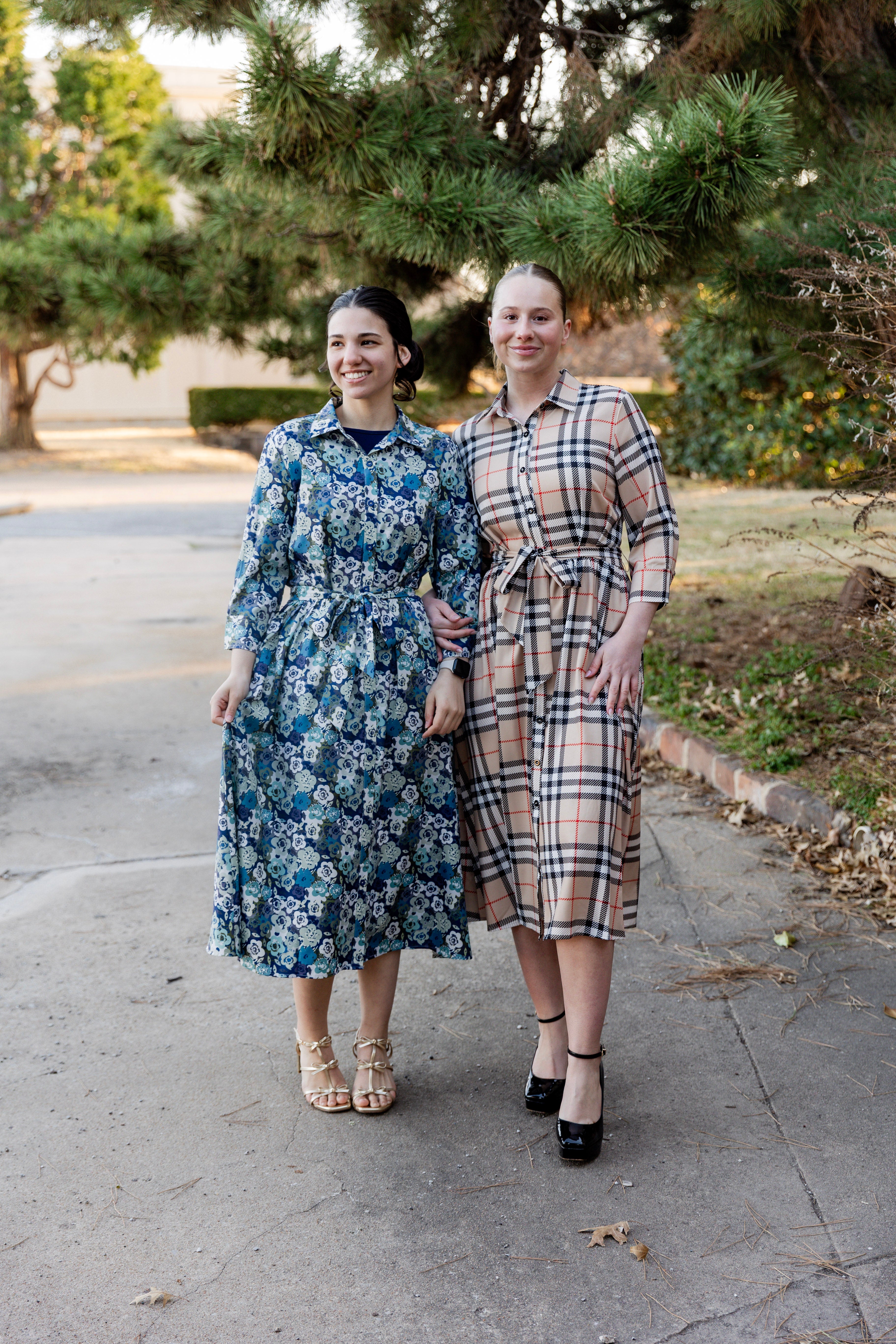 Model wearing the Nuggles® Rachel Dress in Sand Plaid
