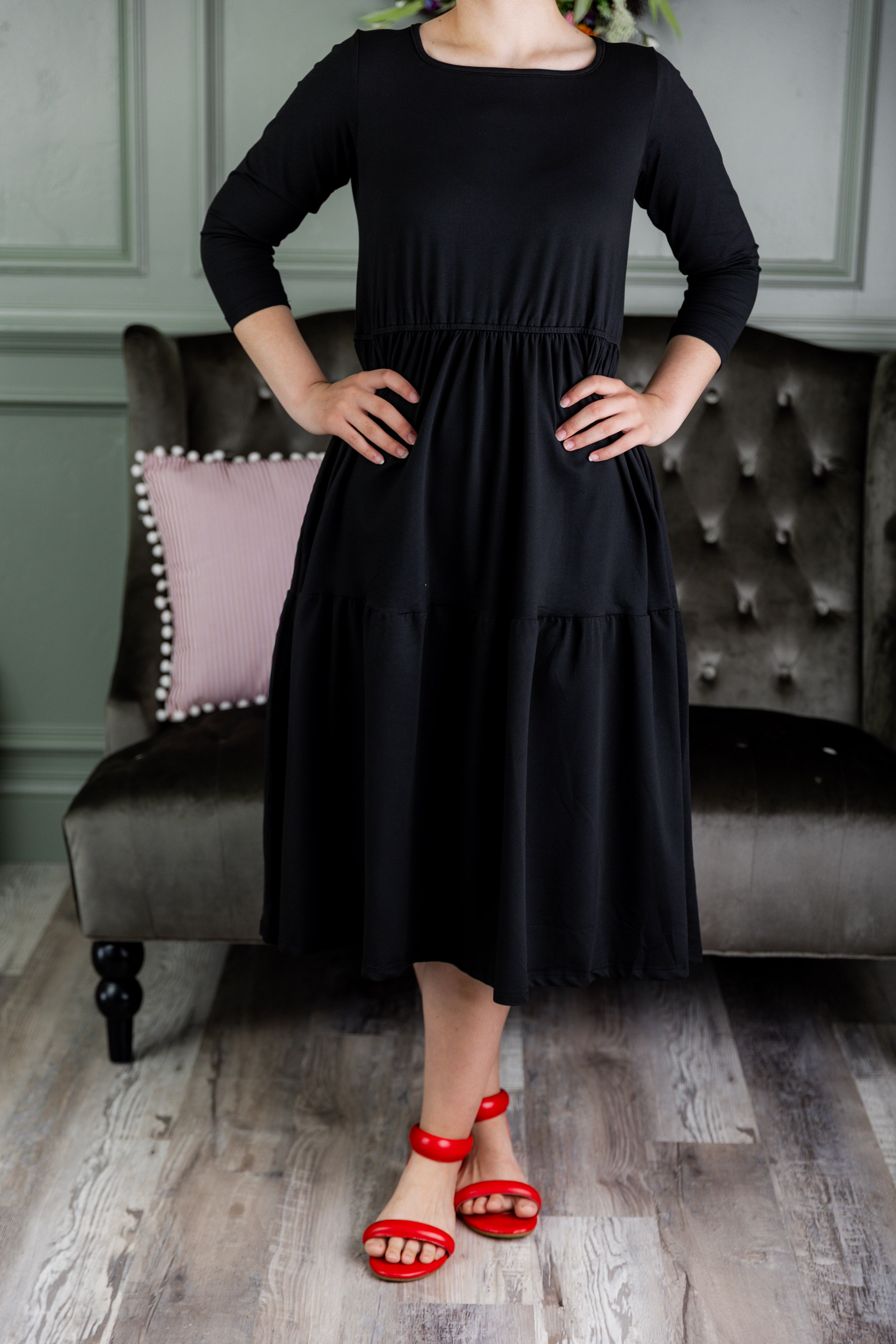 Model wearing Modest Nuggles® Nova Dress in Black