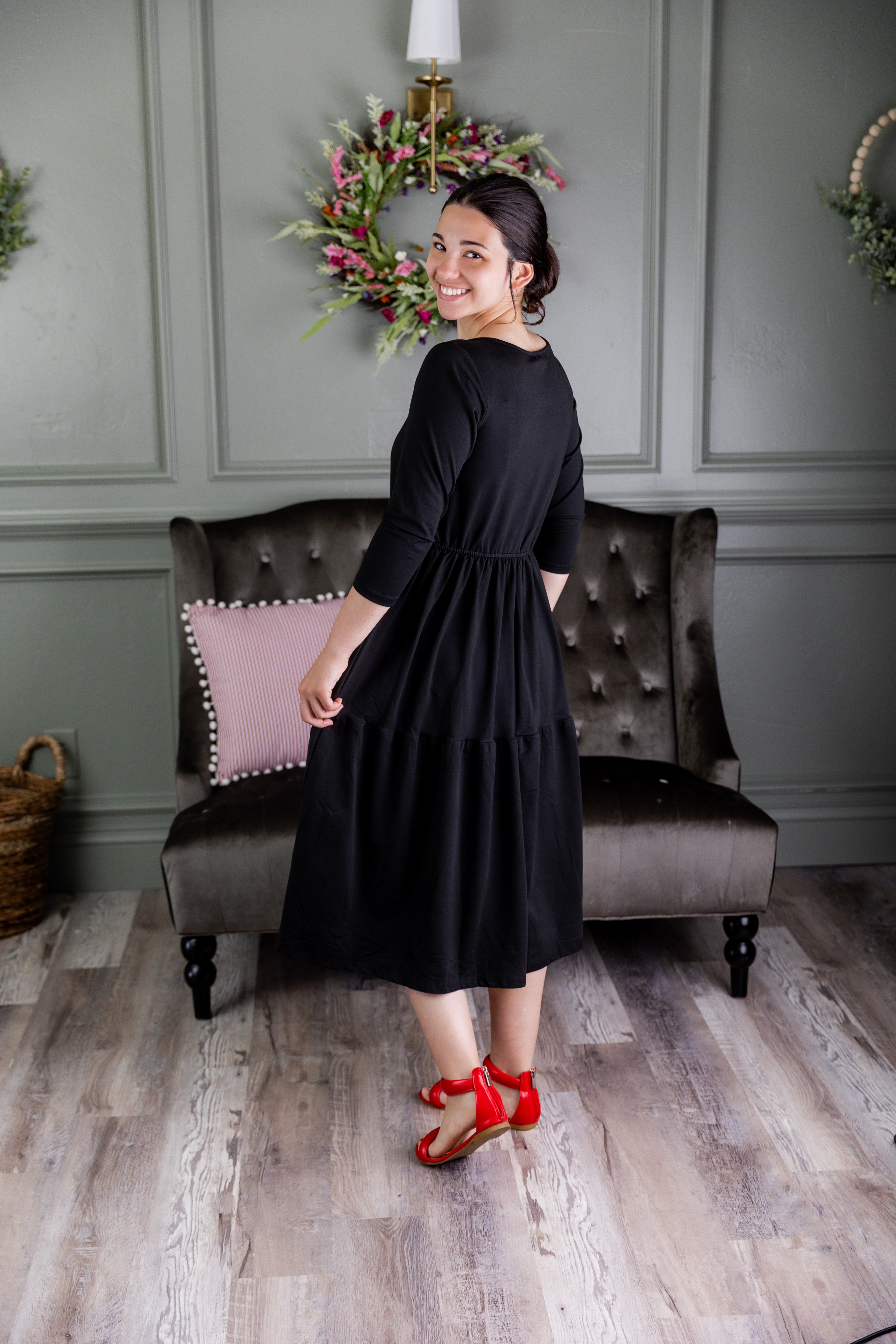 Model wearing Modest Nuggles® Nova Dress in Black