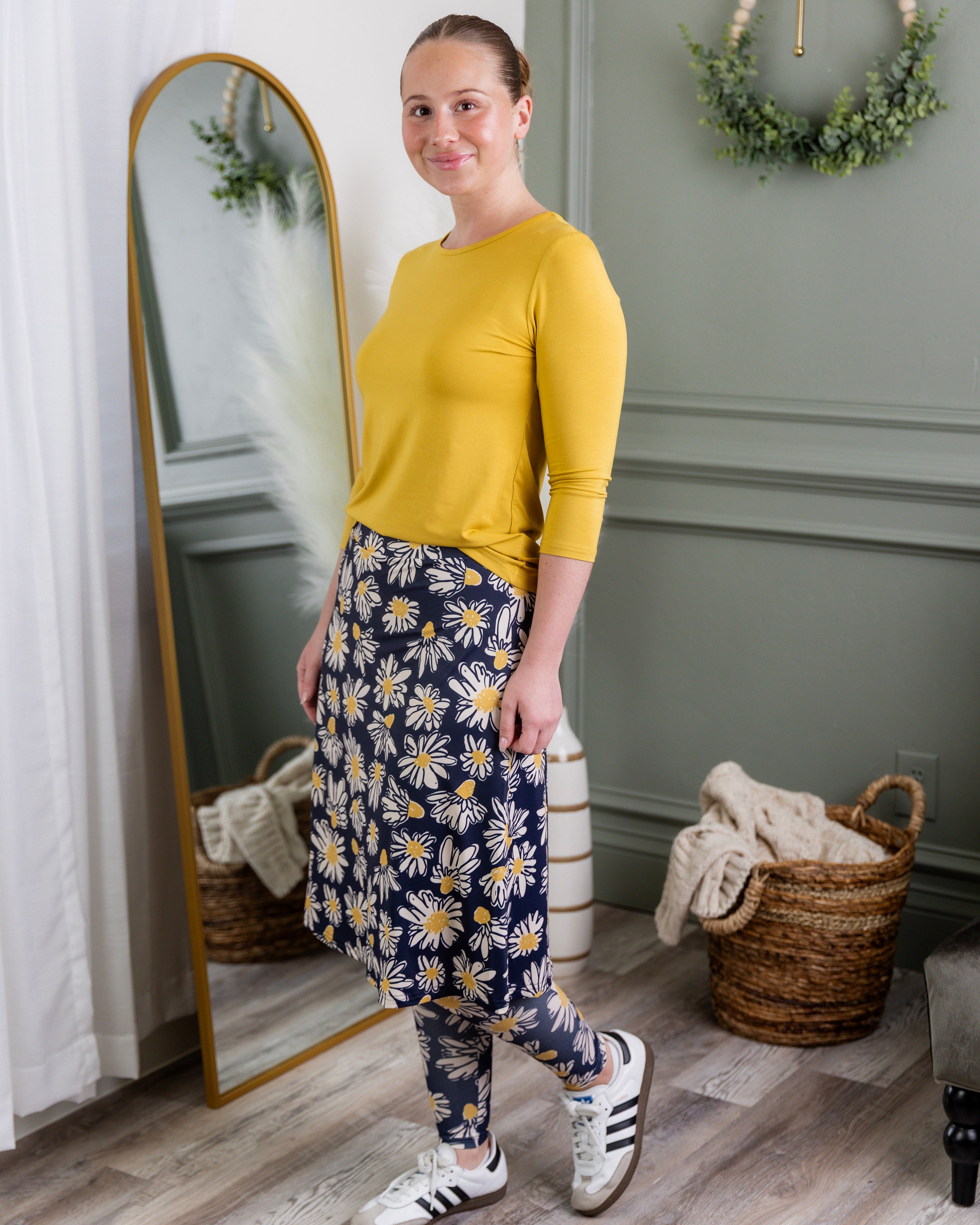 Model wearing Nuggles® Tilly Sport Skirt in Daisy After Dark