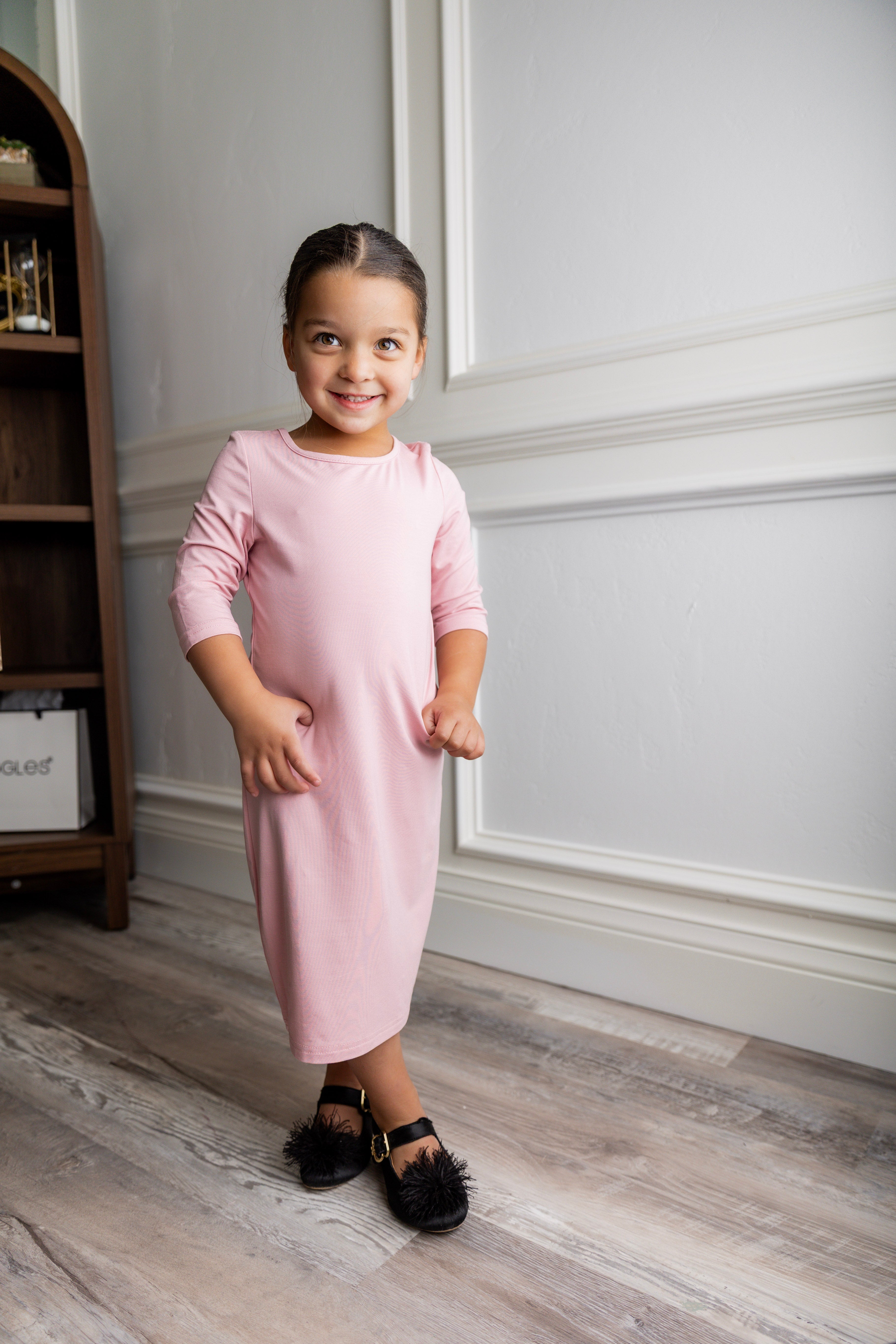 Model wearing our Nuggles® girls midi layering dress