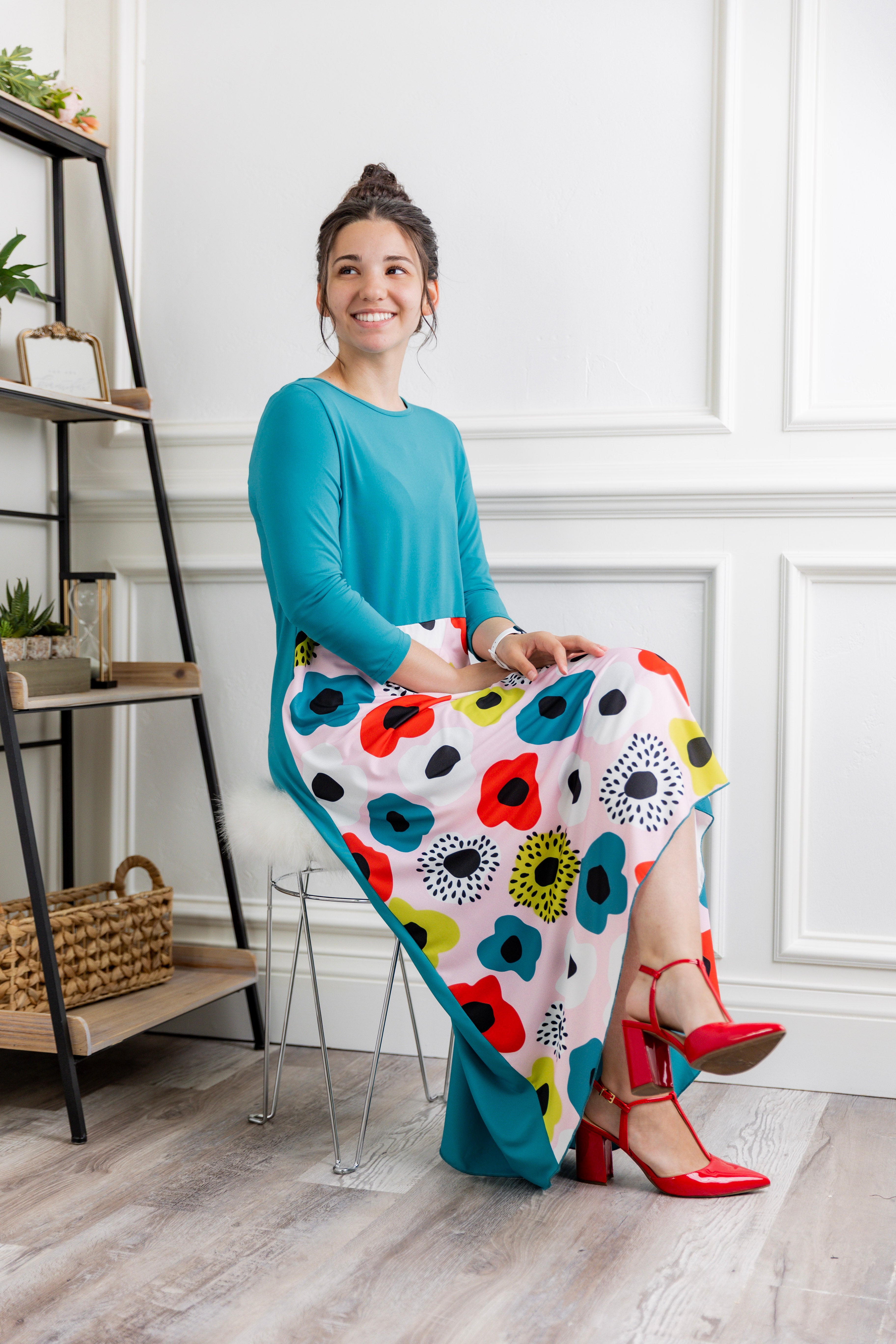 Model modeling Nuggles® Charay Dress with ¾ sleeves and high-low hem. Modest and stylish A-line dress with flattering fit.