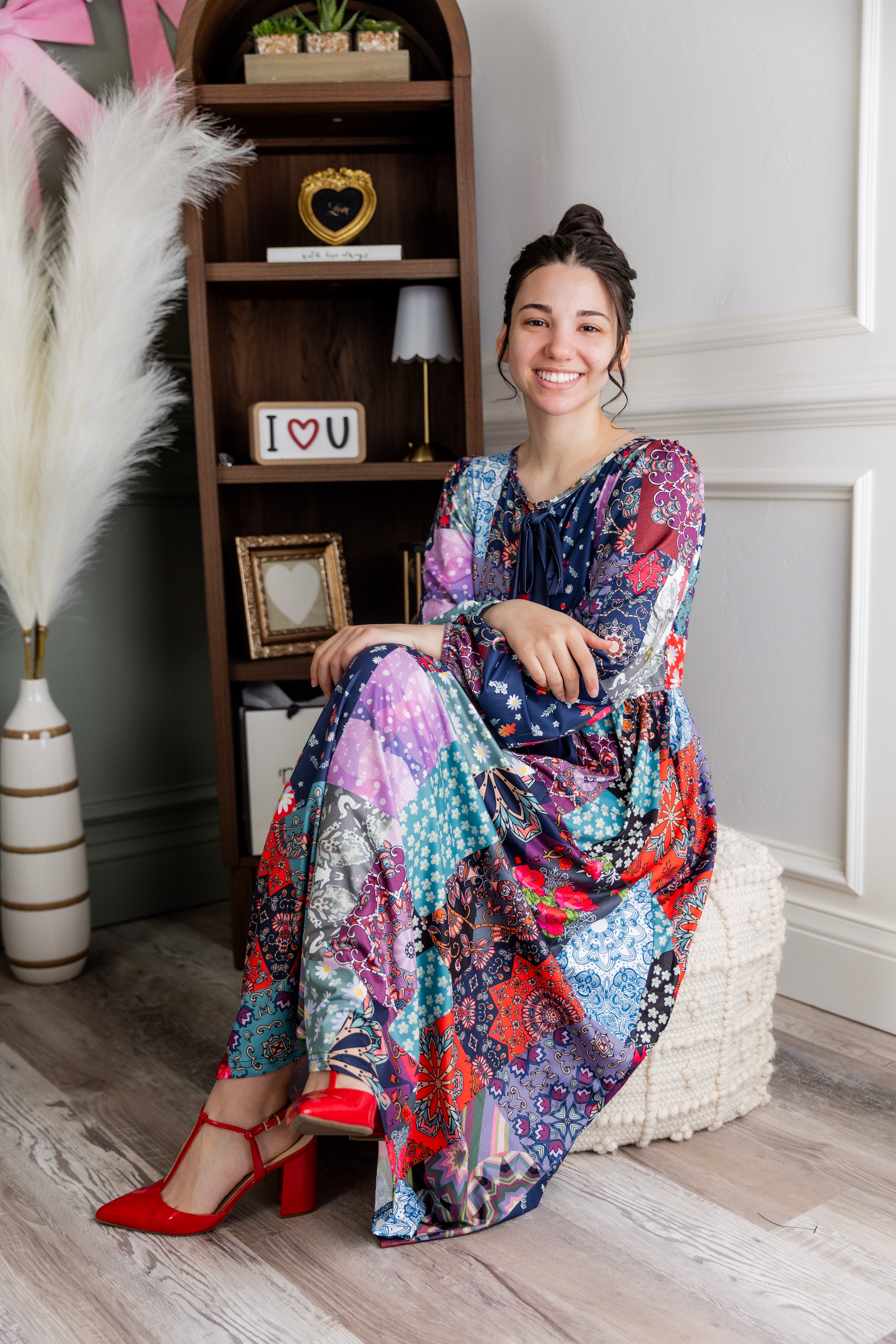 Model wearing the Nuggles® Addison Dress in Stitch & Sparkle