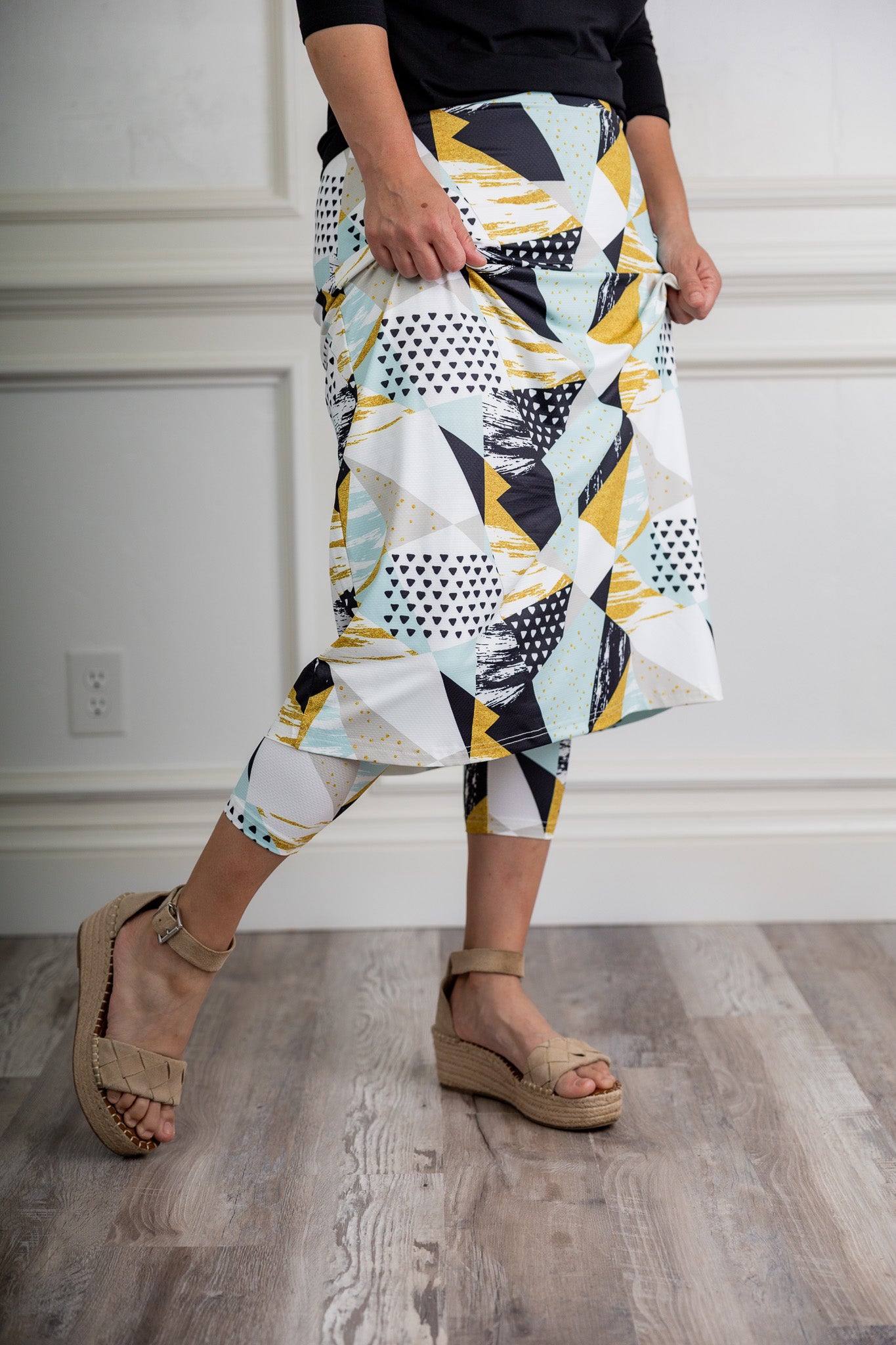 Modest activewear skirt with built-in leggings for women, breathable athletic fabric, paired with sneakers – perfect for workouts or casual wear.