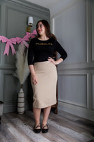 Model wearing Nuggles® 25" Relaxed Skirt in Khaki