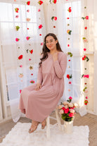 Model wearing the Nuggles® Farah Dress in Baby Pink