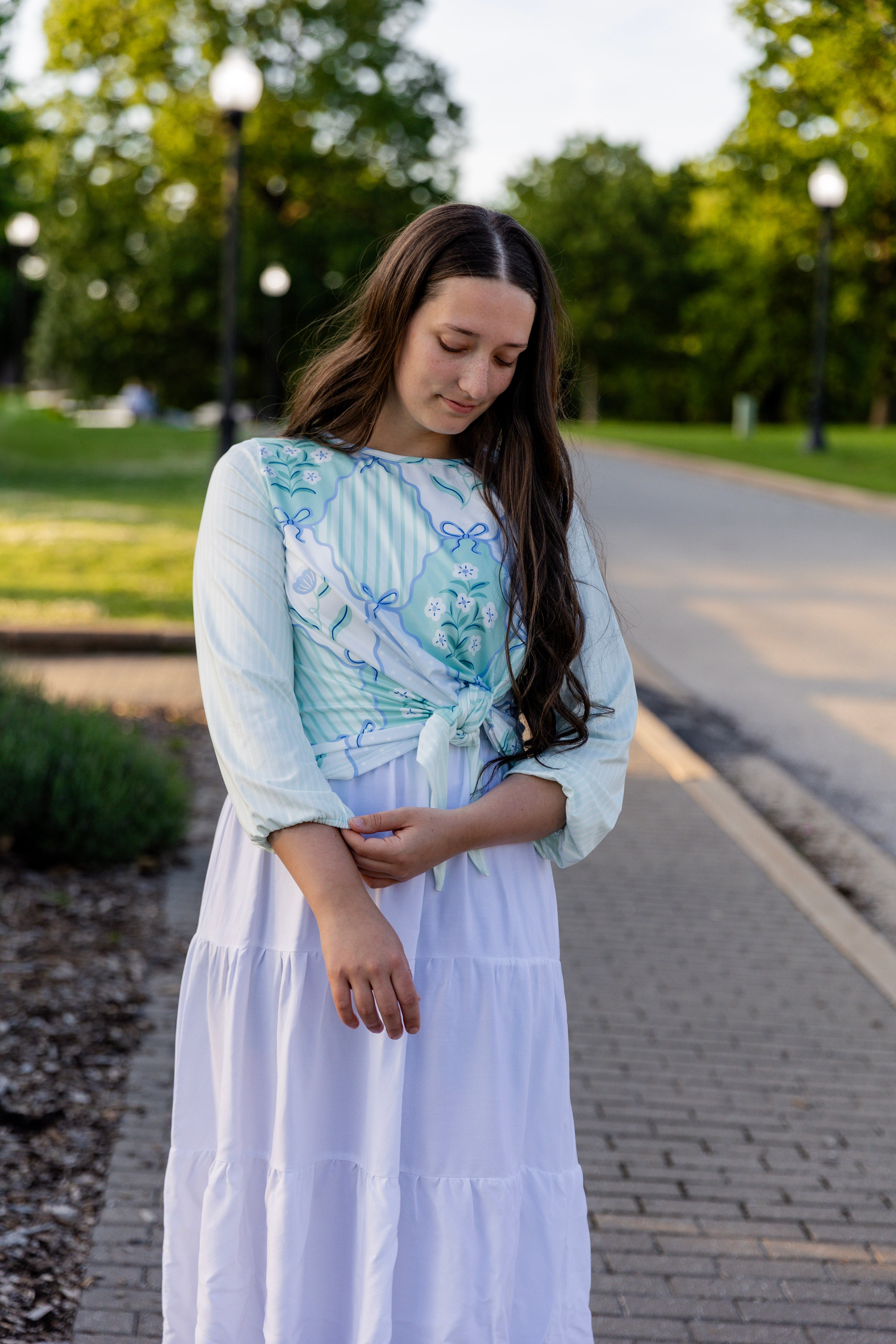 modest long sleeve top with a tie knot and contrasting knit fabrics