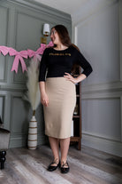 Model wearing Nuggles® 25" Relaxed Skirt in Khaki