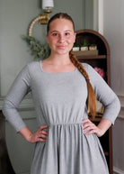 Model wearing Modest Nuggles® Nova Dress in Heather Gray